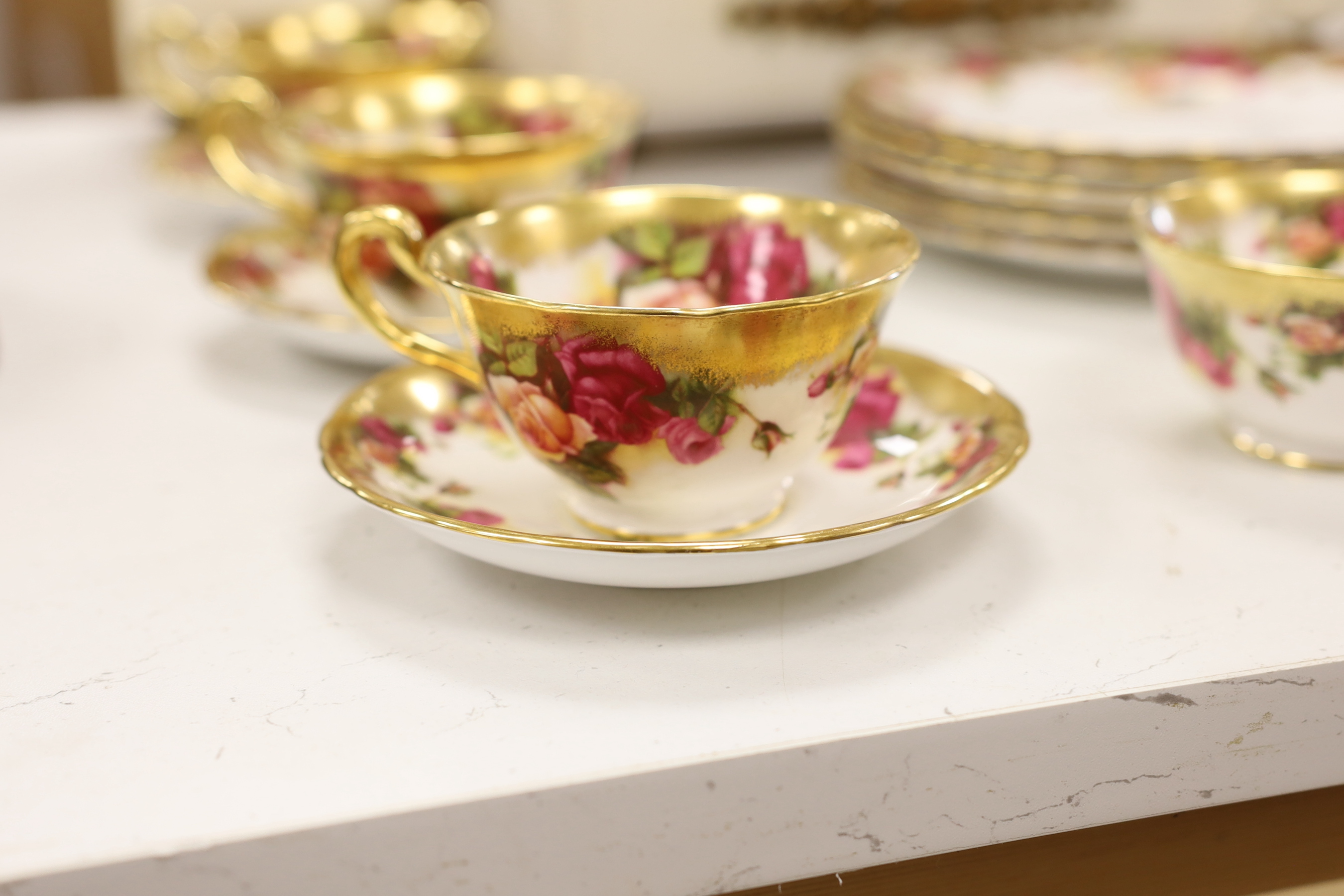 A Royal Chelsea ‘Golden Rose’ pattern part tea service